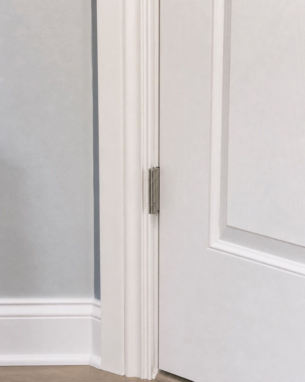 Hands adjusting door hardware during a residential handyman visit