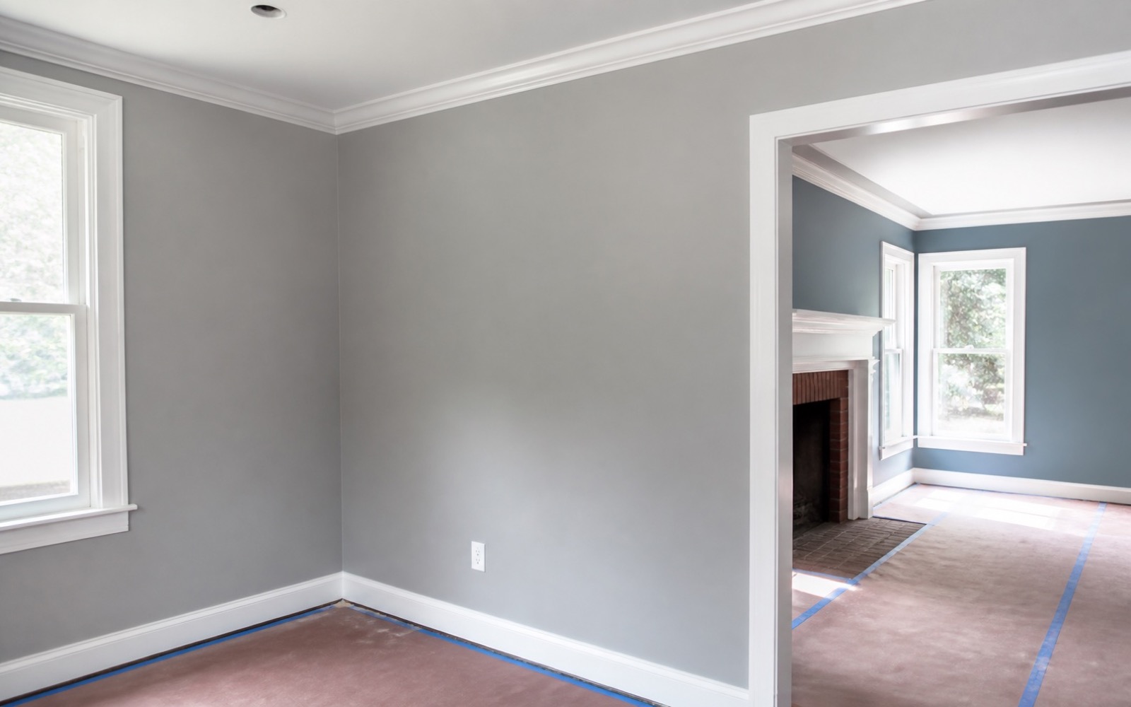Interior painting with crisp trim lines and protected floors